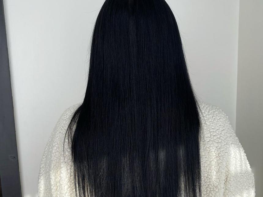 A client one year into wearing her hand-tied extensions