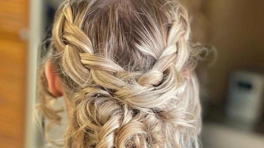 A braided updo styled at Mane Escape Studio in Benwood, West Virginia